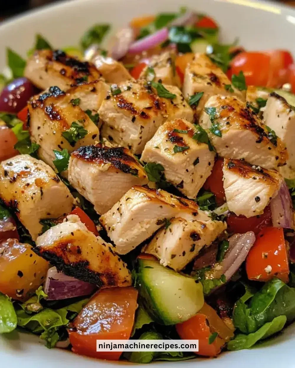 Easy Greek salad with grilled chicken served in a bowl