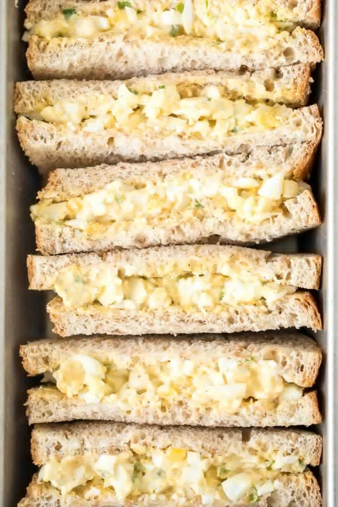 Fresh egg salad sandwich made with creamy dressing and herbs.