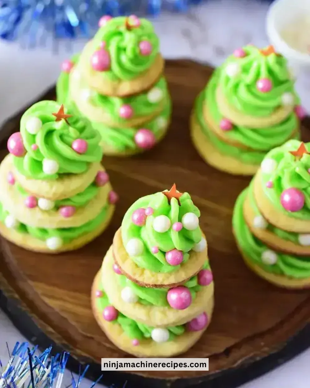 Delicious frosted Christmas tree cookies decorated for the holiday season