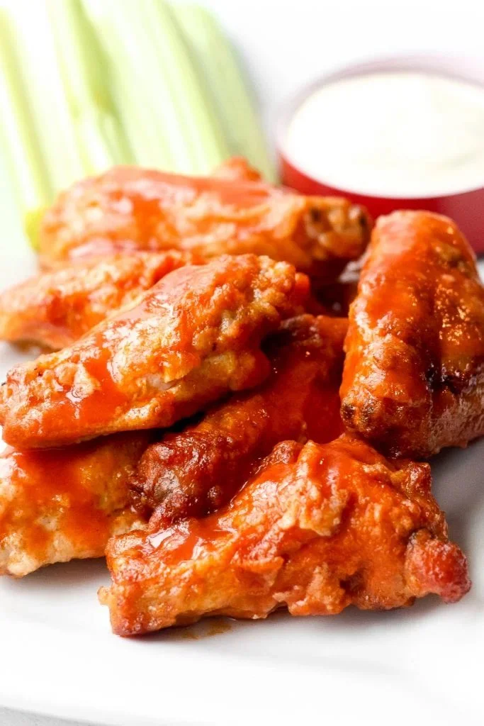 Spicy Buffalo Hot Wings served on a game day platter