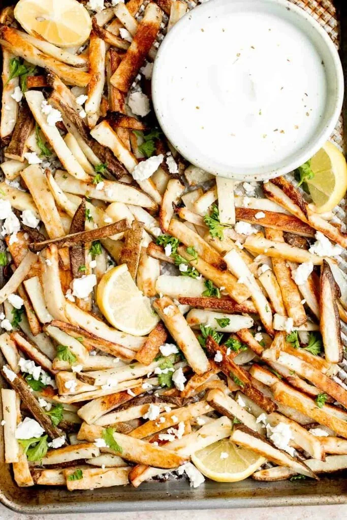 Delicious Greek Fries topped with herbs and spices