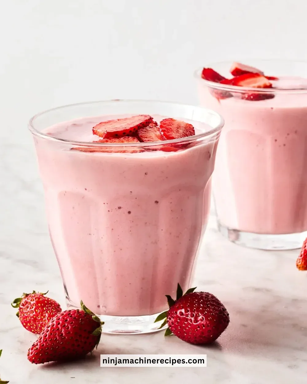 Variety of healthy breakfast smoothies in colorful glass cups