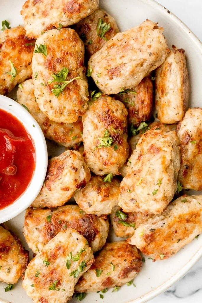 Homemade tater tots with crispy bacon on a plate