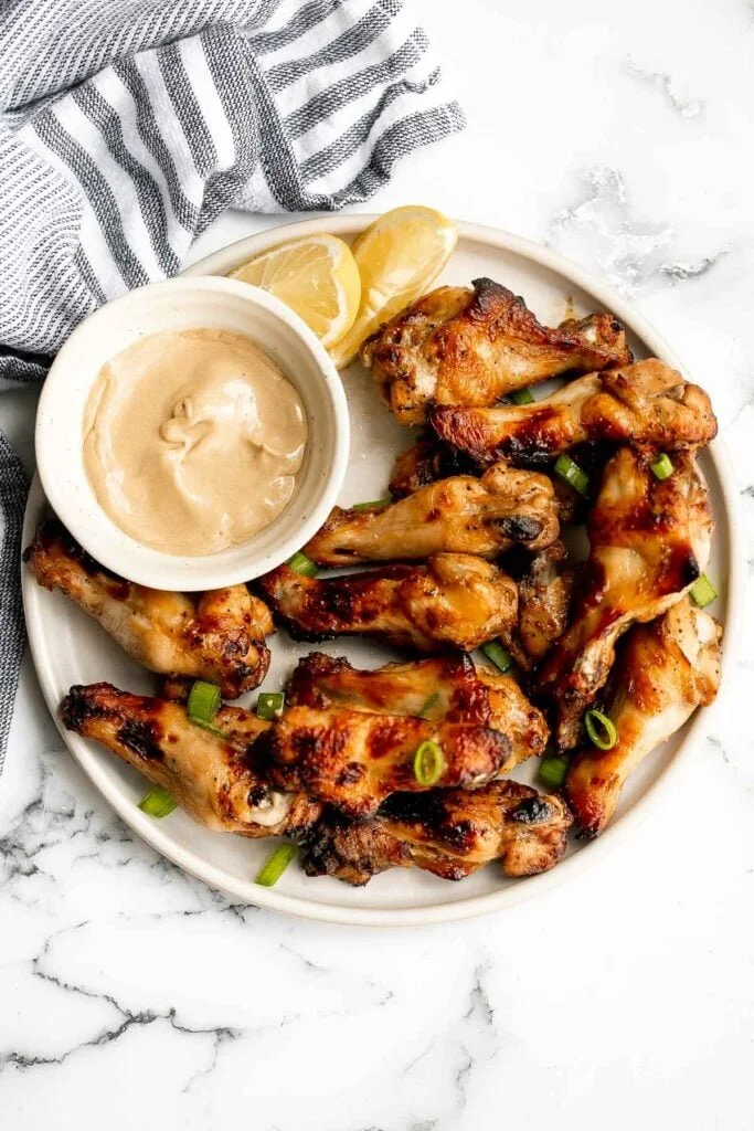 Honey Mustard Chicken Wings served with dipping sauce on a platter