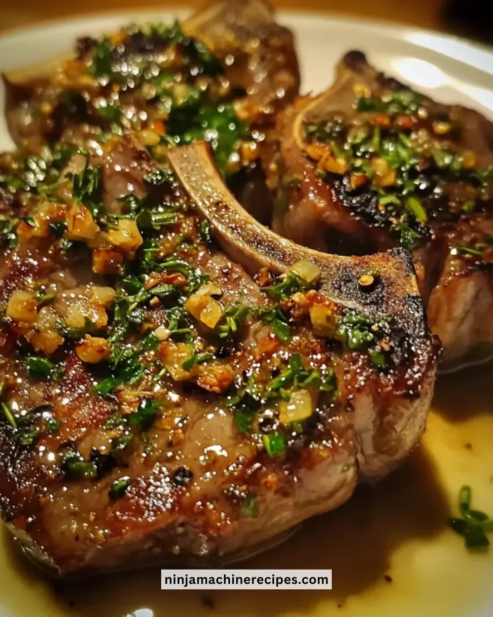Juicy garlic herb lamb chops served with fresh herbs and spices