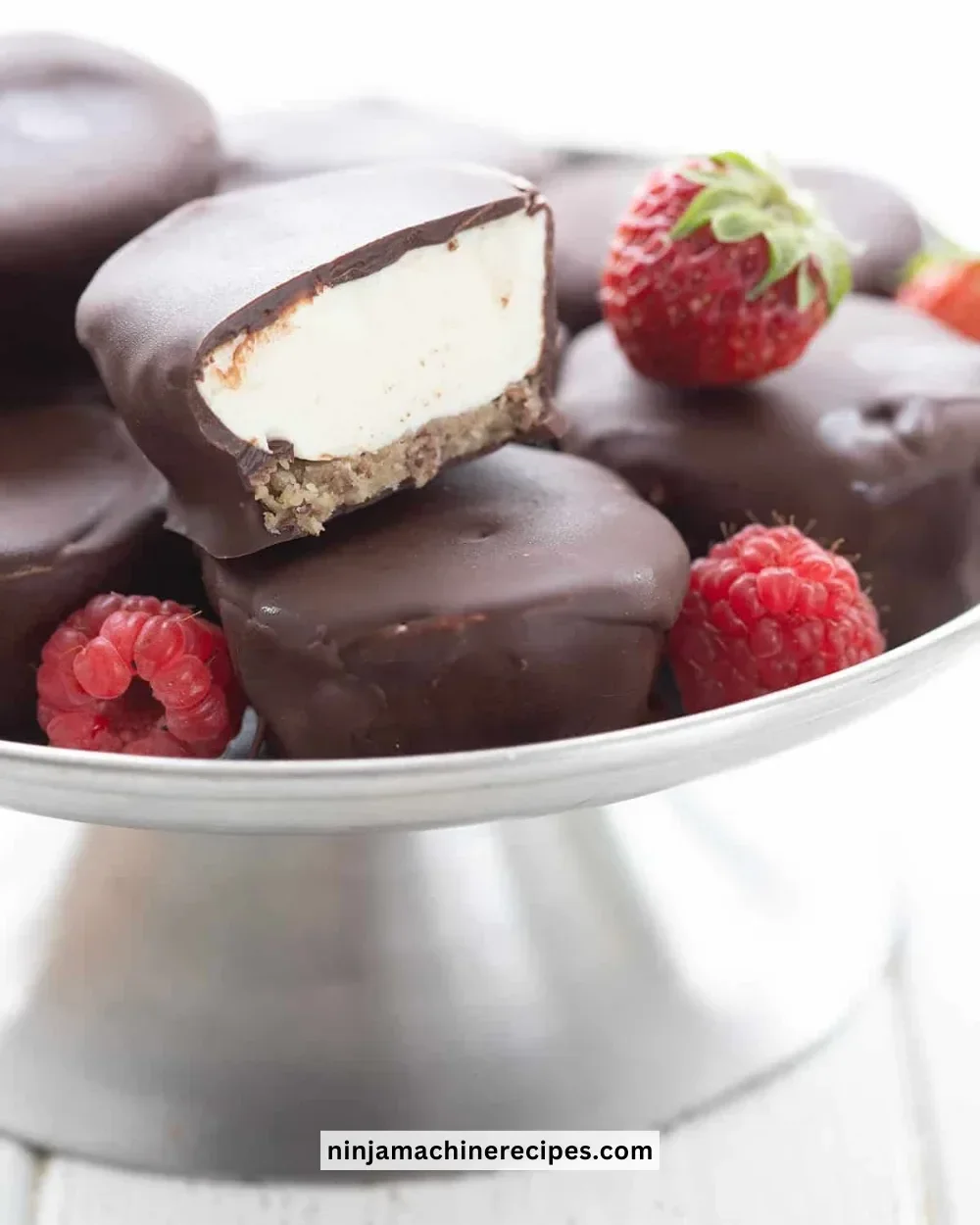 Delicious Keto Cheesecake bites, a low-carb dessert treat, topped with fresh berries.