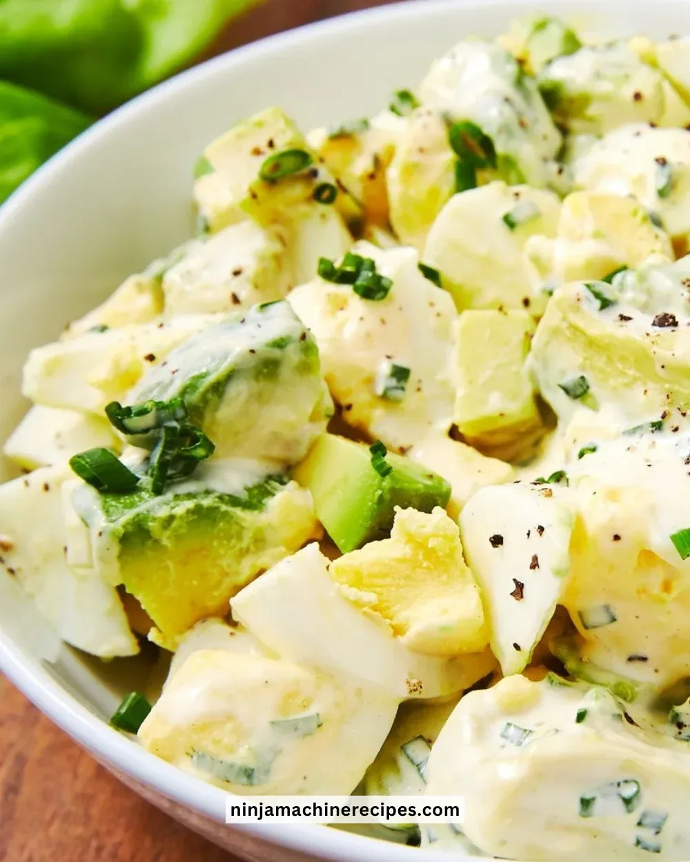 Delicious Keto Egg Salad served in a bowl with fresh herbs and low-carb ingredients.