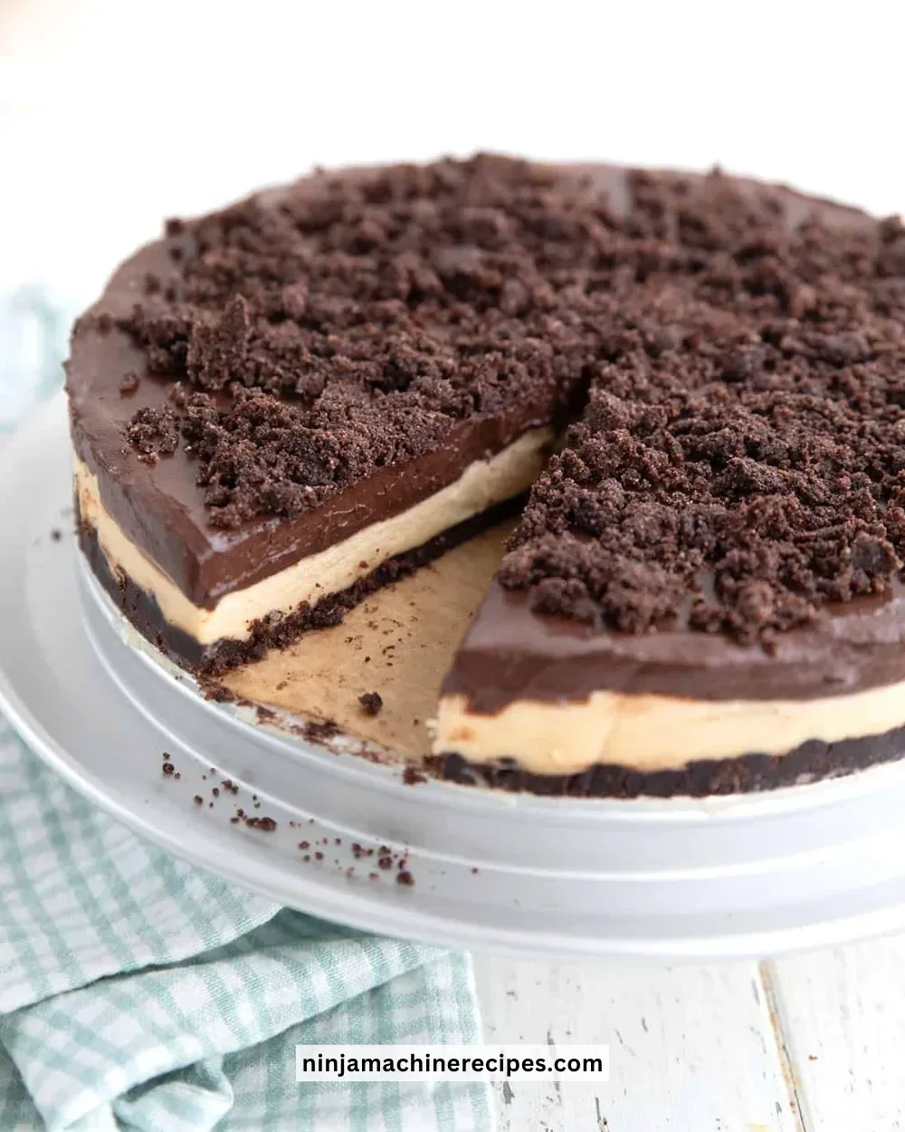 Keto Peanut Butter Dirt Cake topped with chocolate and nuts