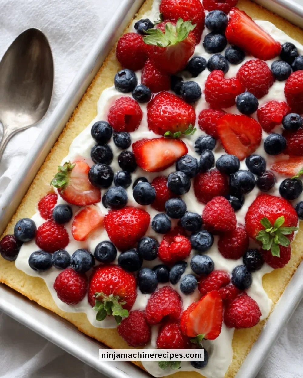 Lemon-Berry Trifle in a sheet pan with layers of fruit and cream