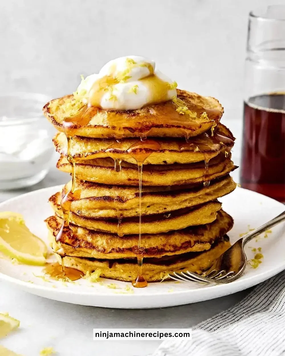 Fluffy lemon ricotta protein pancakes stacked with fresh fruit