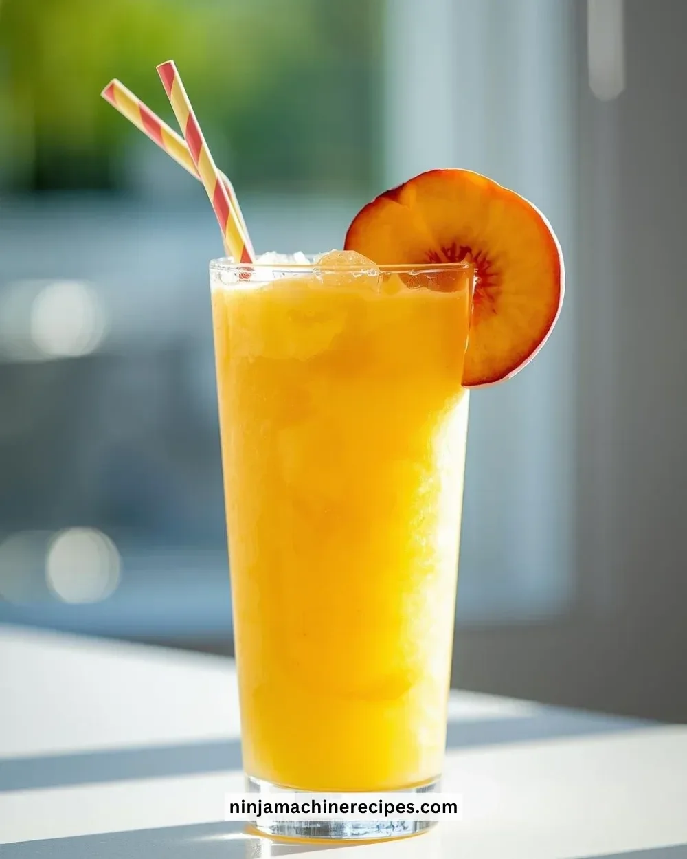 Refreshing Mango Peach Slushie with vibrant colors in a glass