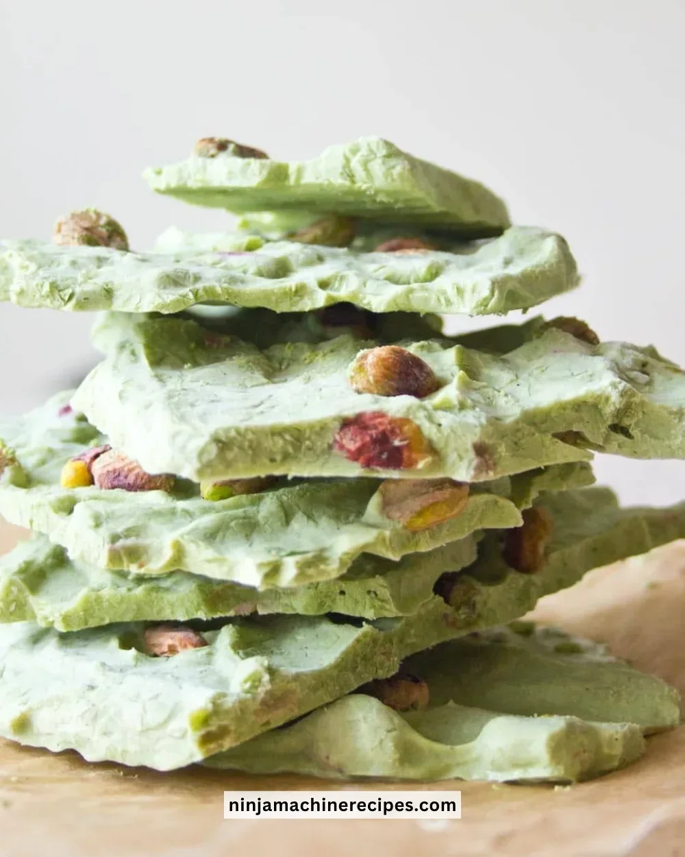Delicious matcha frozen yogurt bark topped with fresh fruits and nuts