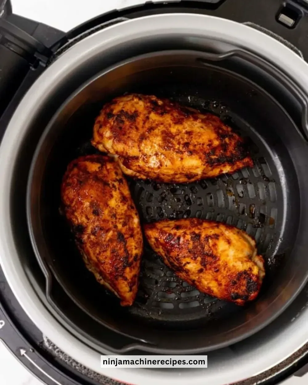 Ninja Foodi cooking frozen chicken breast for a quick meal