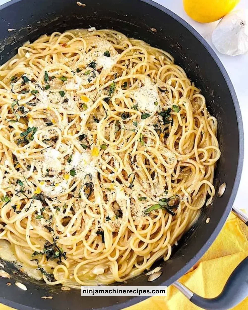 Delicious One-Pot Lemon Butter Pasta served with fresh herbs and lemon slices.