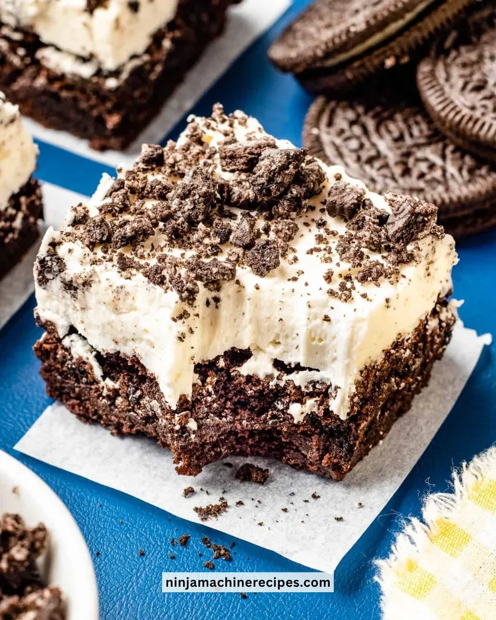 Decadent Oreo brownies topped with crushed Oreos and chocolate chips
