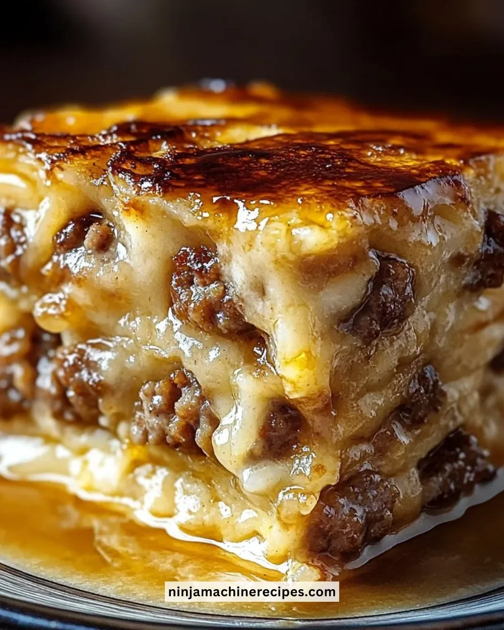 Pancake sausage casserole with fluffy pancakes and savory sausage on a plate.