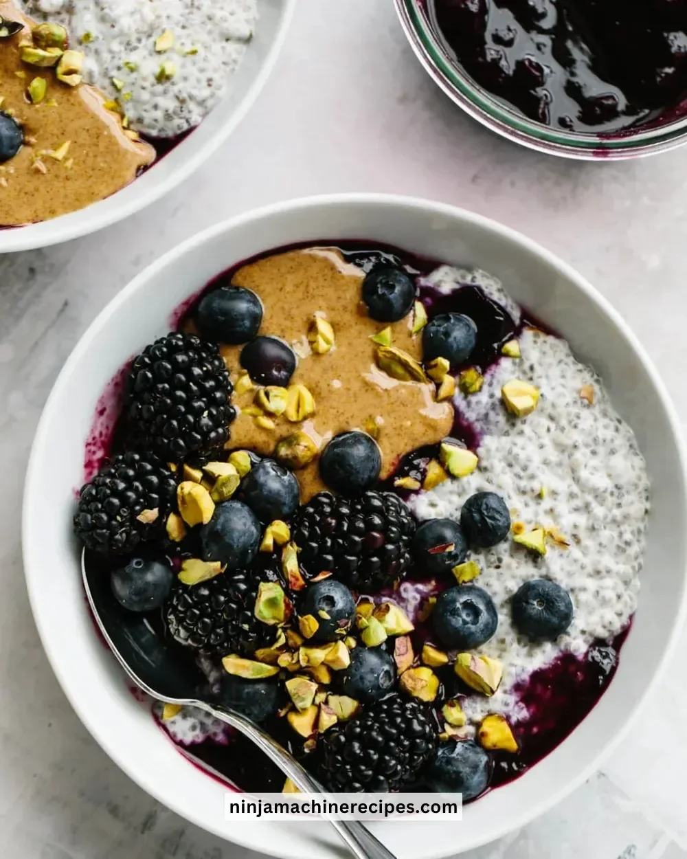 Peanut Butter and Jelly Chia Pudding served in a glass bowl