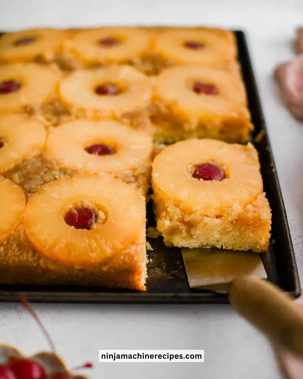 Delicious Pineapple Upside Down Cake with caramelized pineapples and cherries