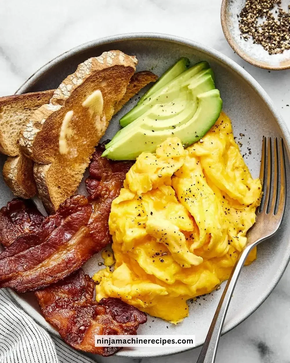 Delicious fluffy scrambled eggs served on a plate