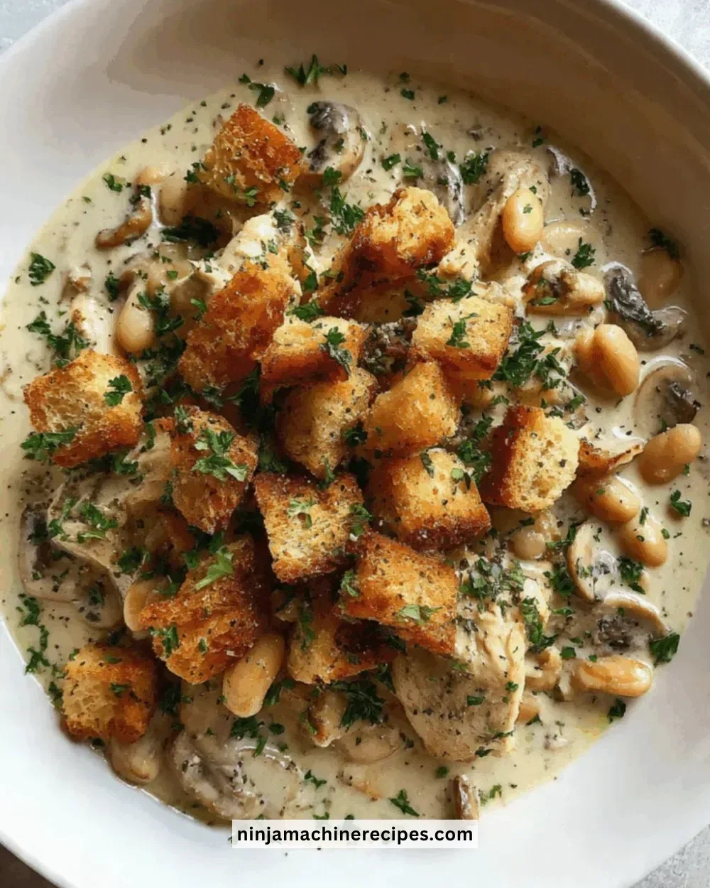 Slow cooker garlic butter chicken with herbs and spices in a rustic setting