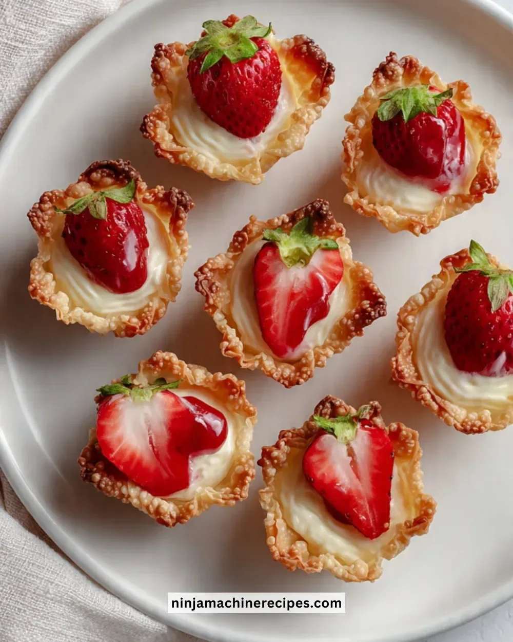 Delicious strawberry cheesecake wonton bites served on a plate