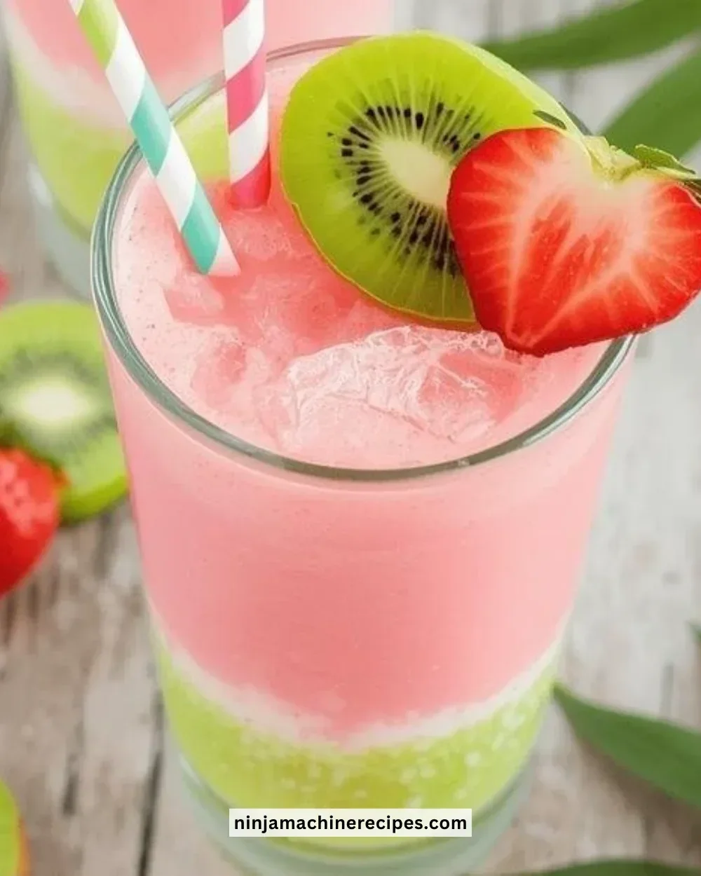 Refreshing Strawberry-Kiwi Slushie garnished with fresh strawberries and kiwis