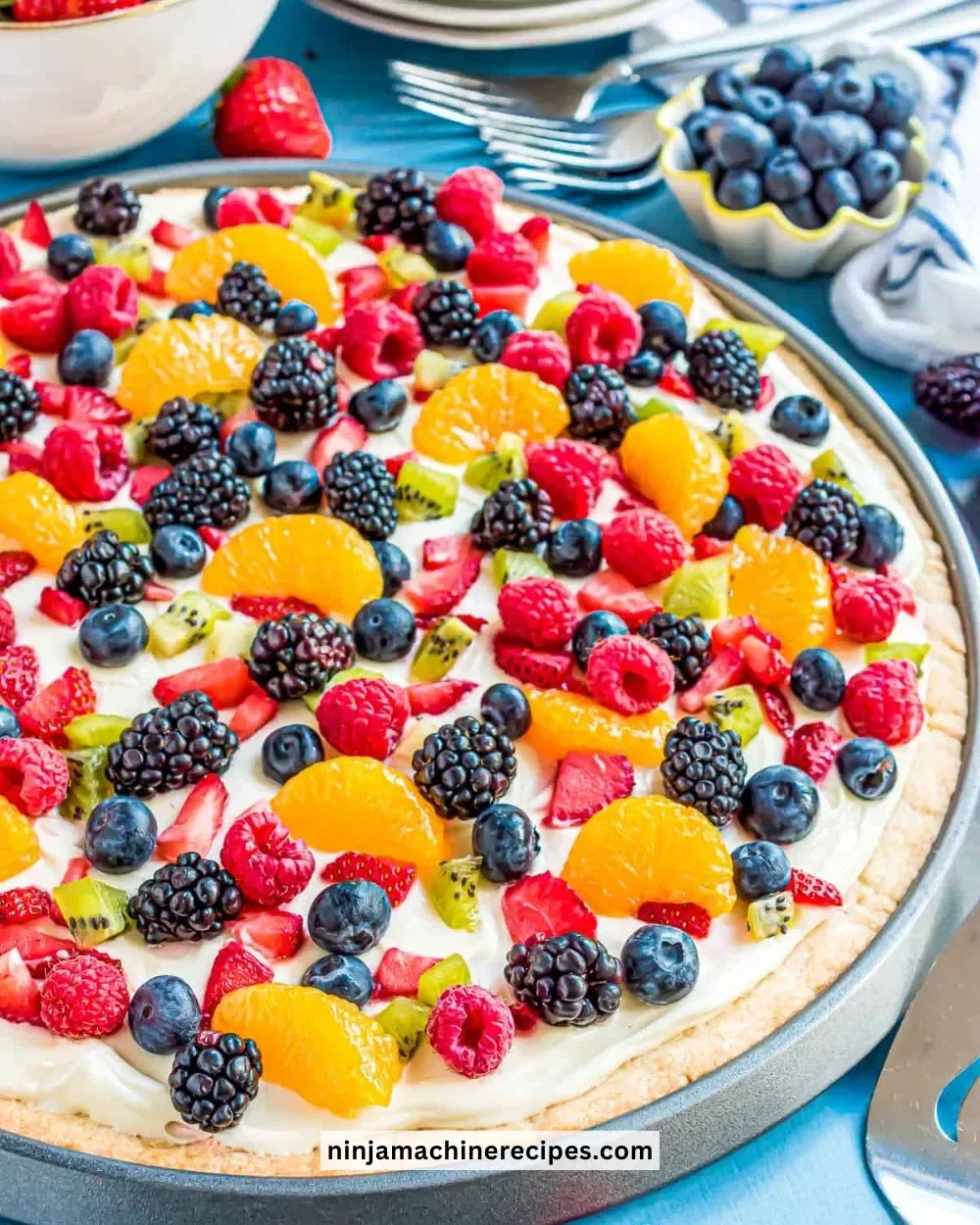 Colorful sugar cookie fruit pizza topped with fresh berries and kiwi slices