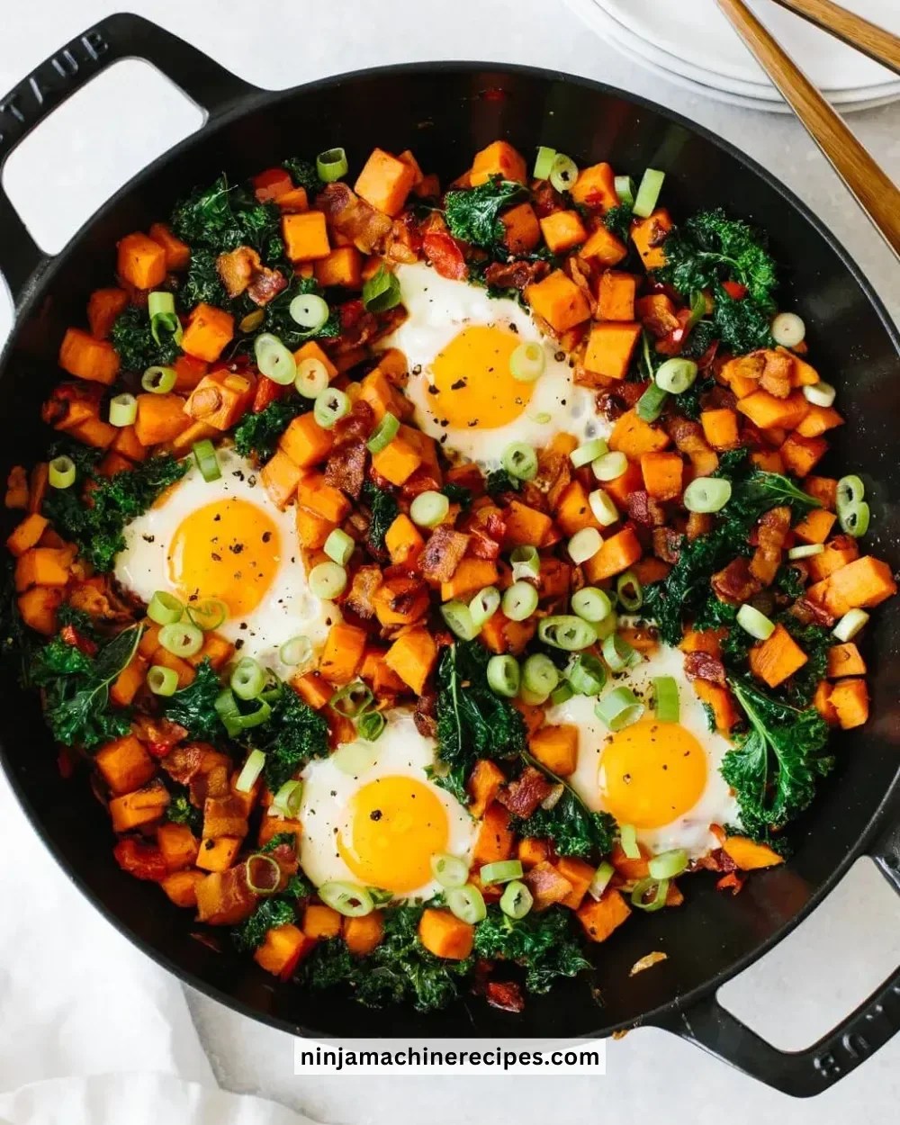 Sweet Potato Breakfast Hash served in a bowl with herbs and spices.