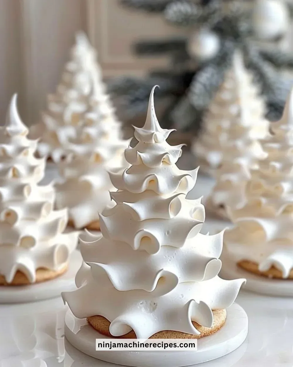 Decorative tree-shaped meringue cookies, perfect for holidays and celebrations.