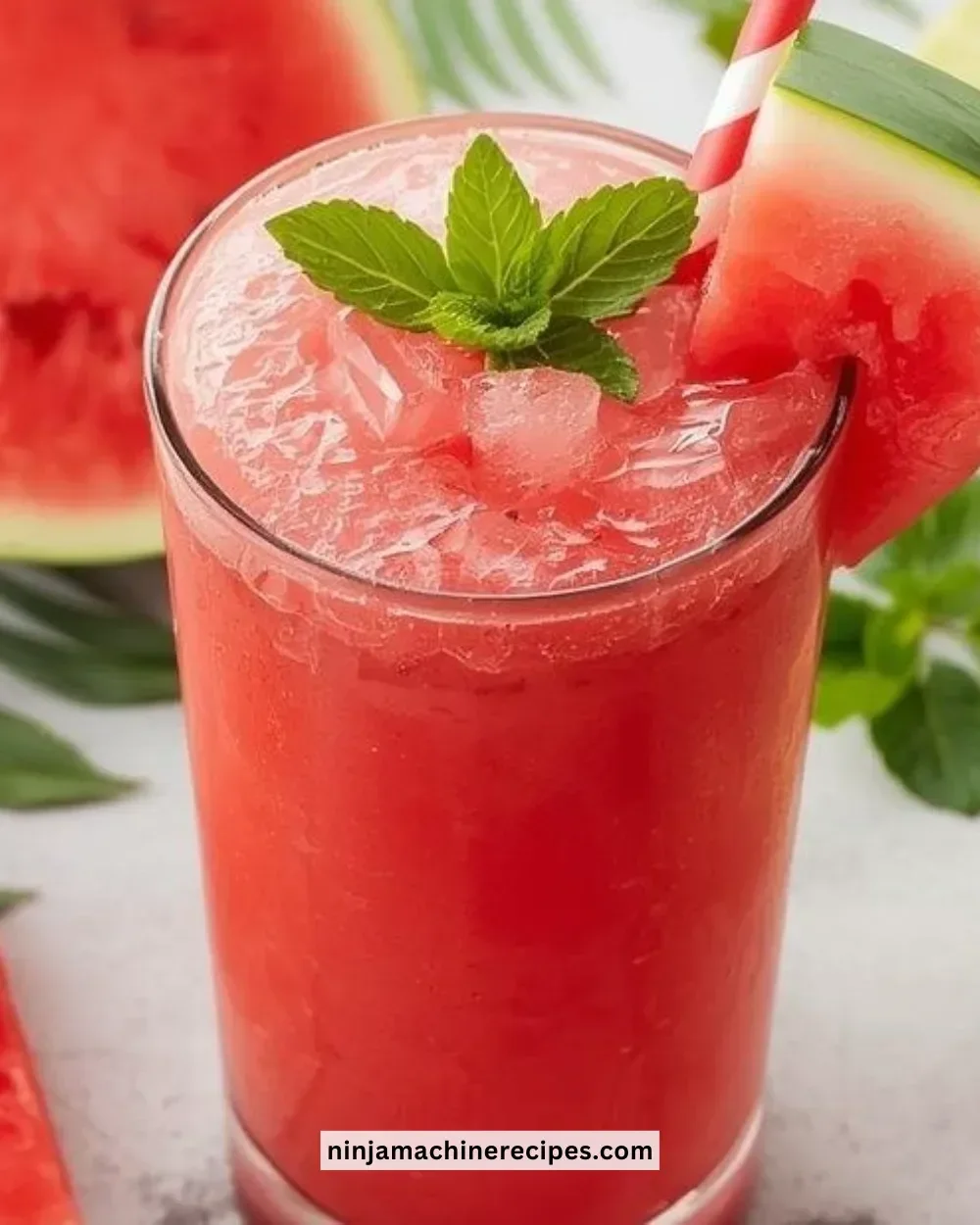 Refreshing watermelon mint lime slushies in a glass with mint leaves on top