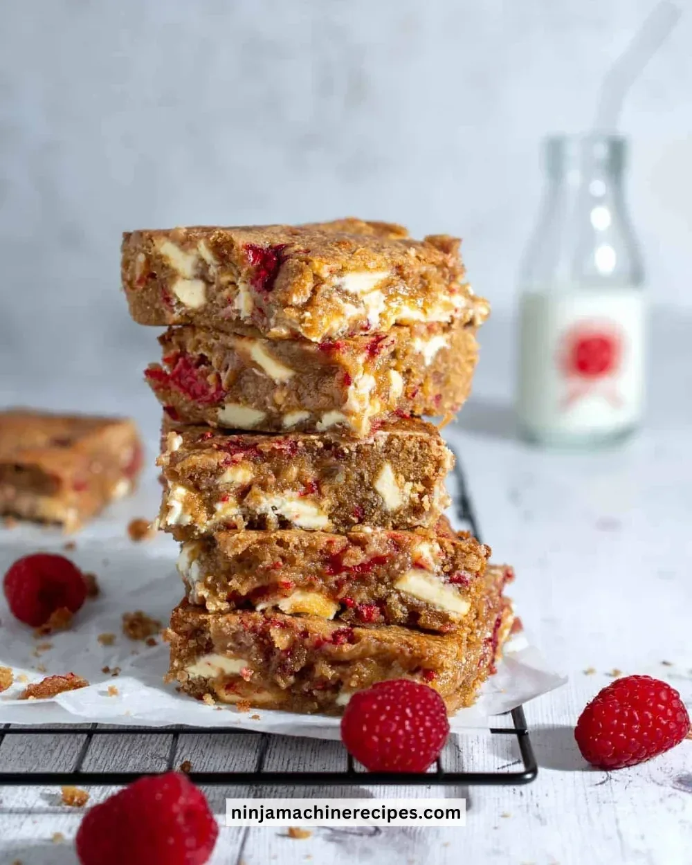 Delicious white chocolate raspberry blondies served on a plate