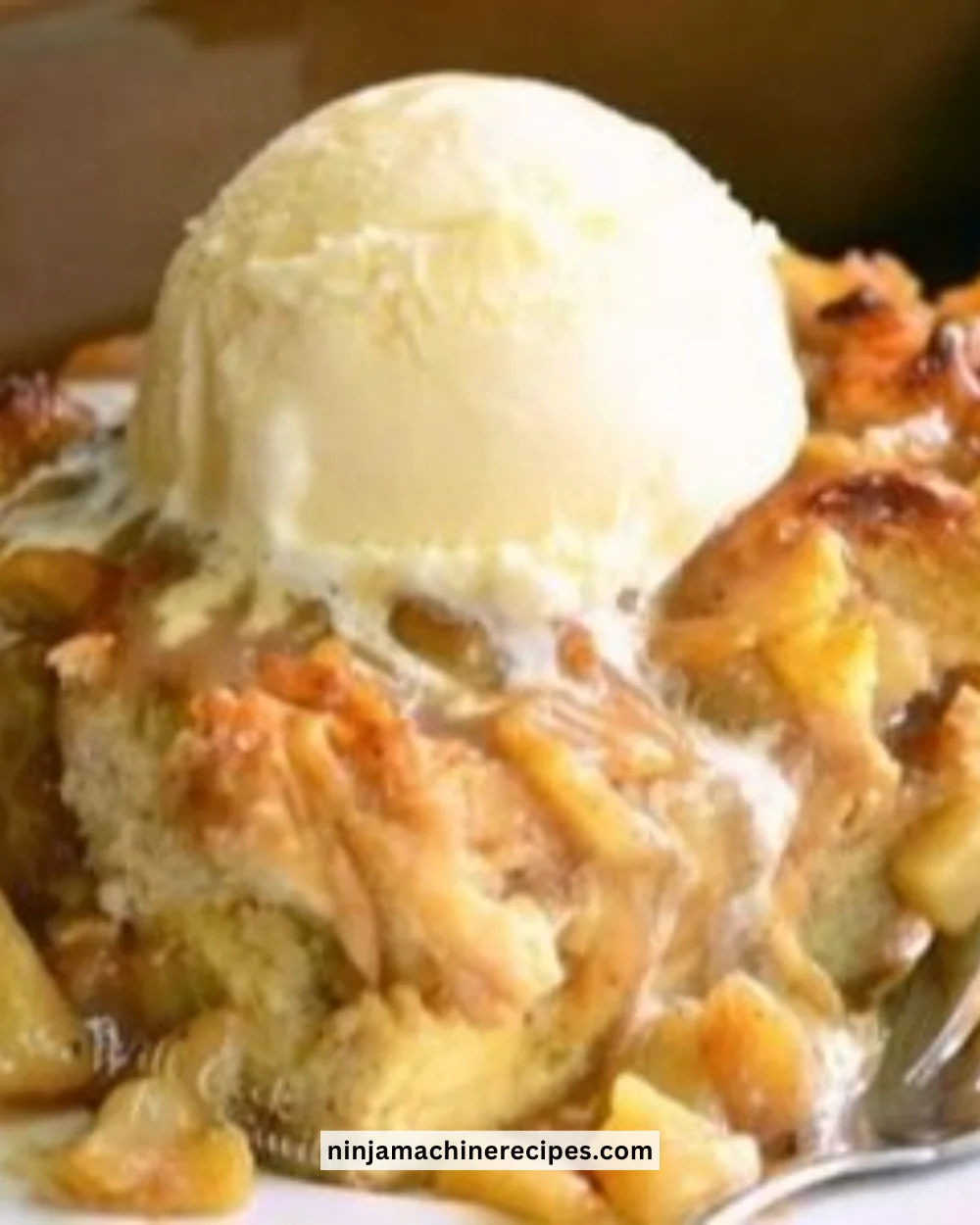 Delicious apple pie bread pudding served with a drizzle of caramel sauce