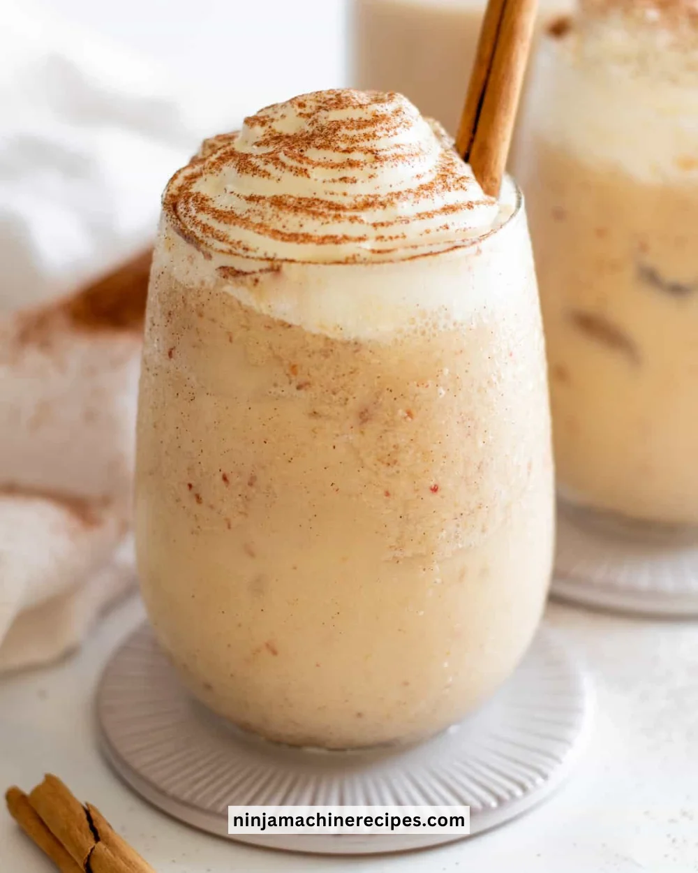 Delicious apple pie smoothie topped with cinnamon and whipped cream