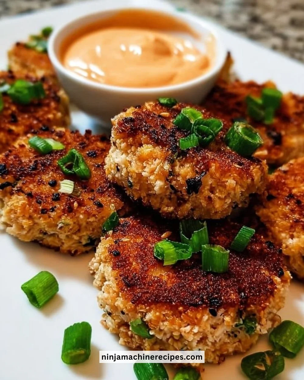 Asian Tuna Cakes served with spicy mayo for a flavorful dish.