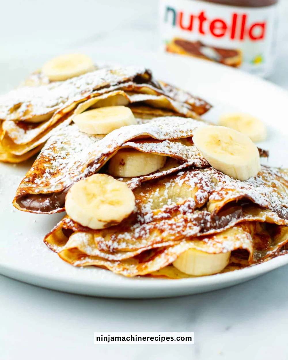 Delicious Banana Nutella Crepes with fresh bananas and Nutella spread