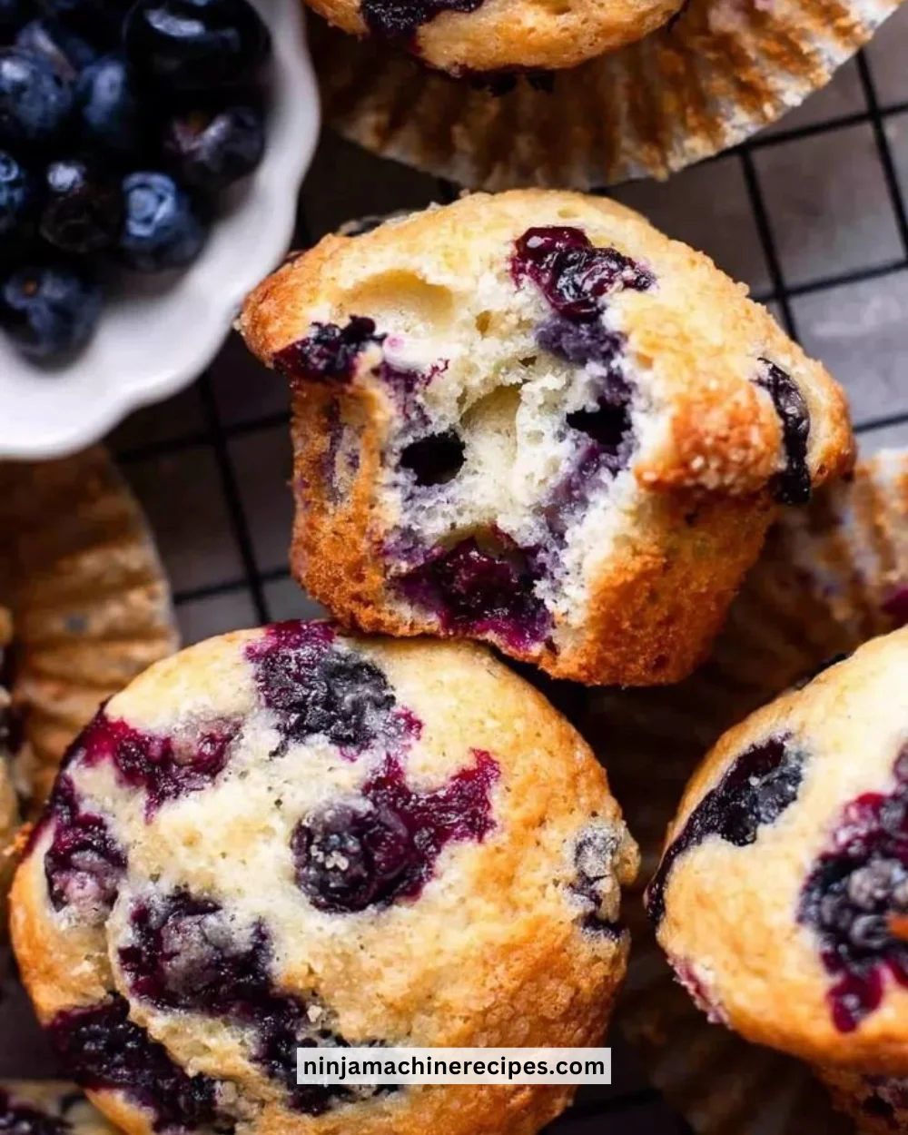 Freshly baked blueberry muffin bread with blueberries on a plate