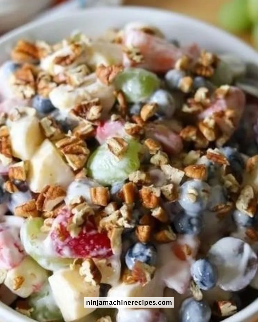 Colorful breakfast fruit salad with assorted fresh fruits in a bowl.