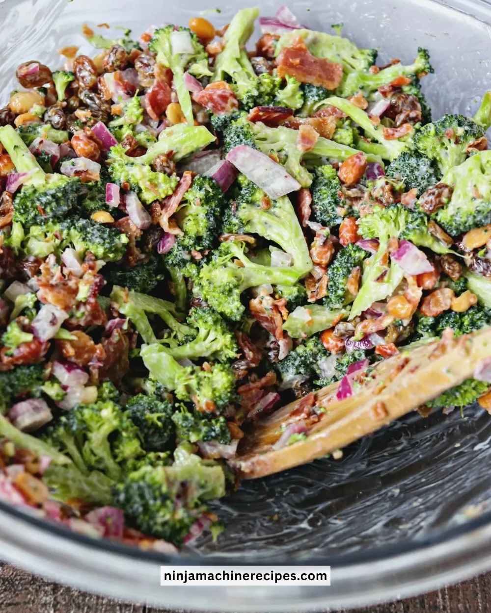 Bowl of Broccoli Salad with Bacon, mixed with fresh vegetables and dressing