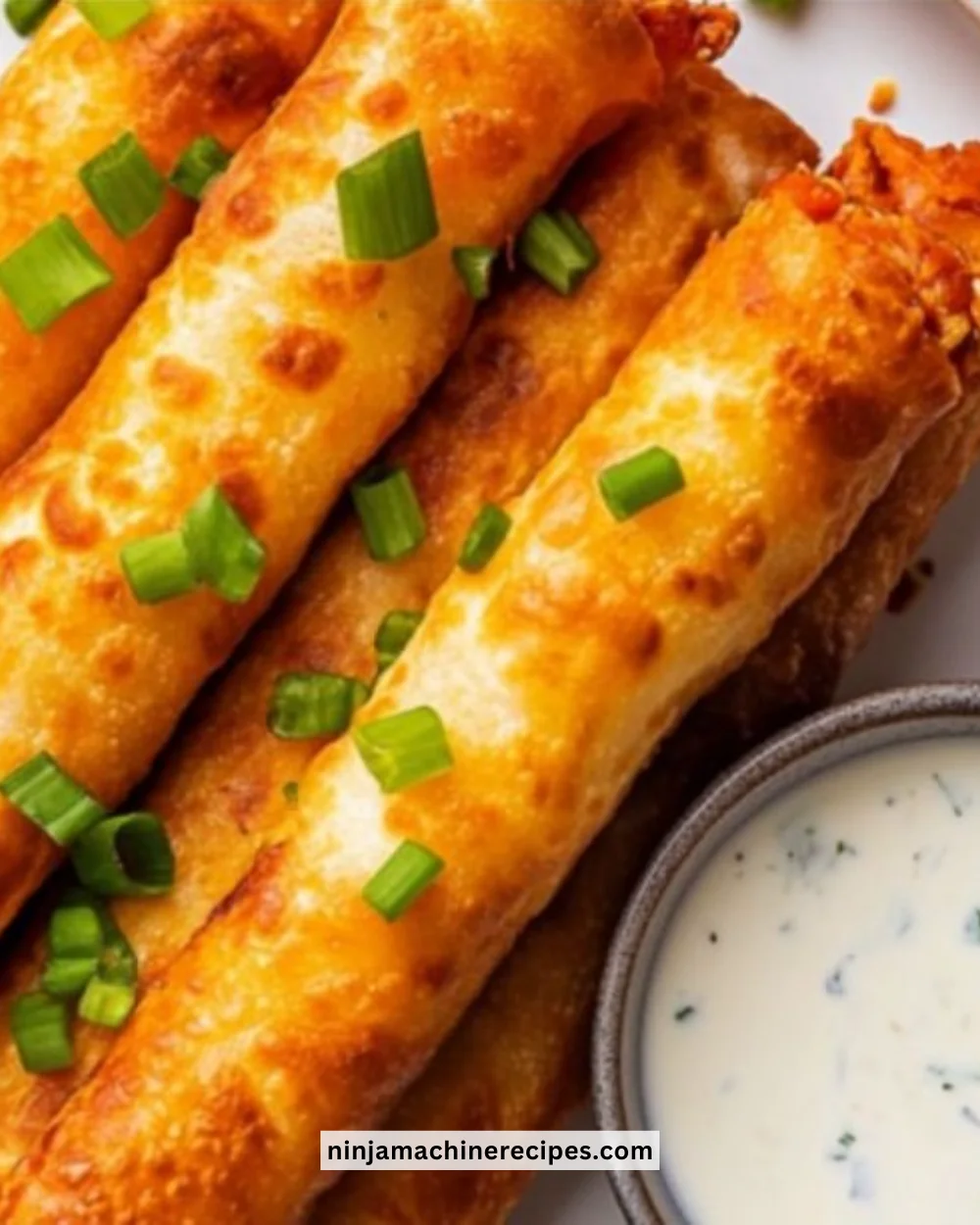 Crispy Buffalo Chicken Taquitos served with dipping sauce