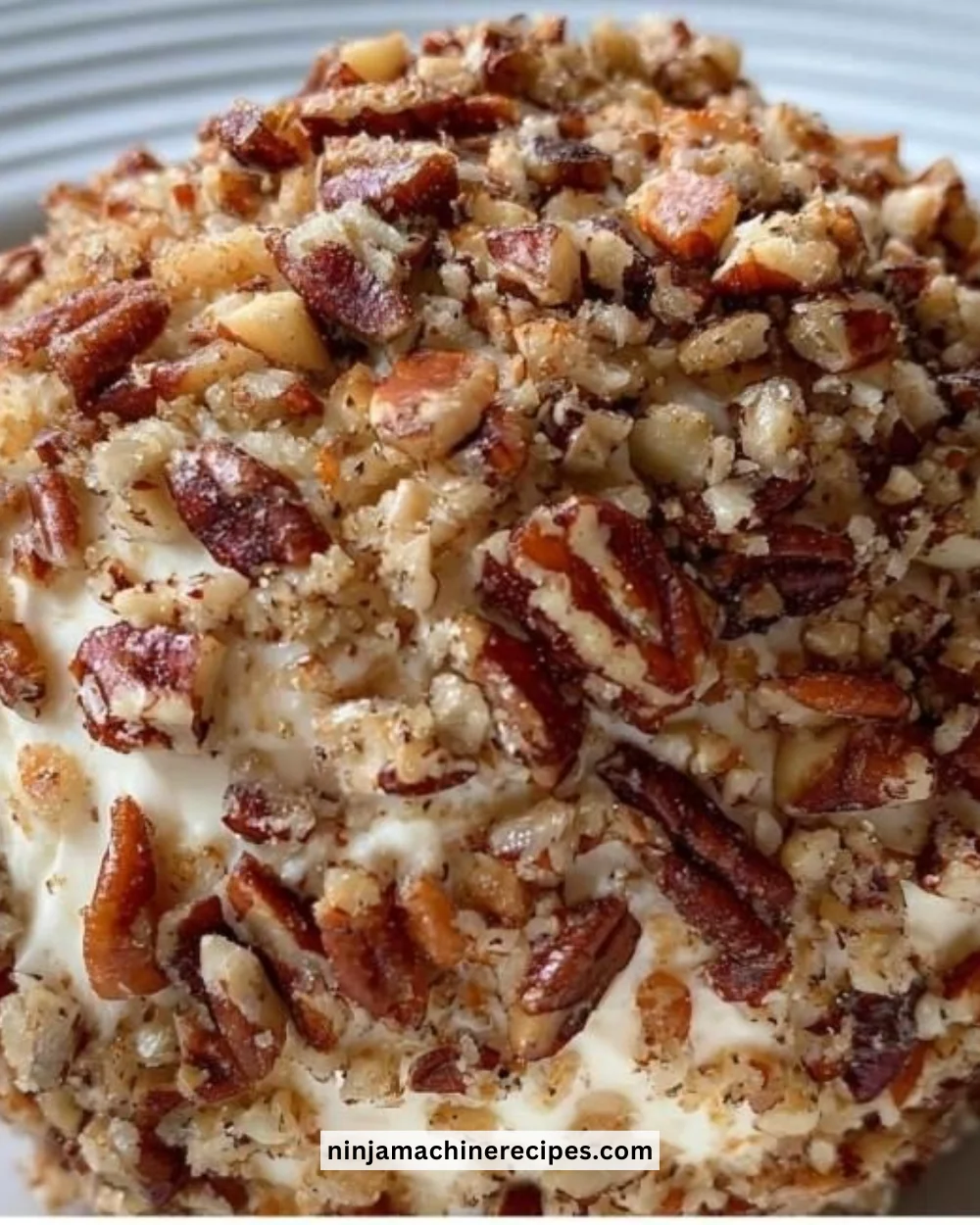 Delicious homemade Cheese Ball served with crackers and fresh herbs.