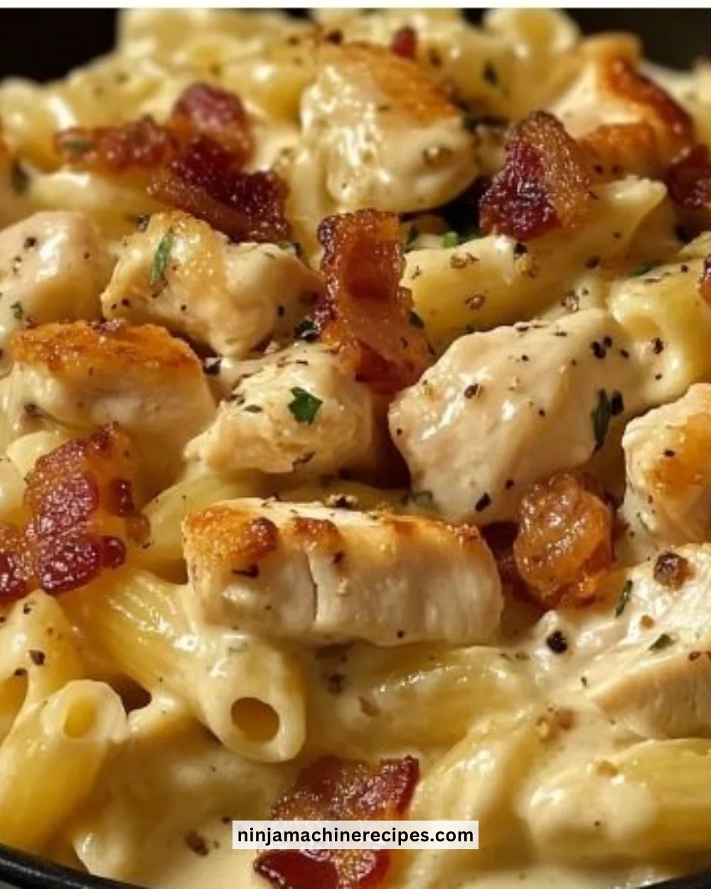 Creamy Chicken Bacon Ranch Pasta dish with fresh herbs and crispy bacon