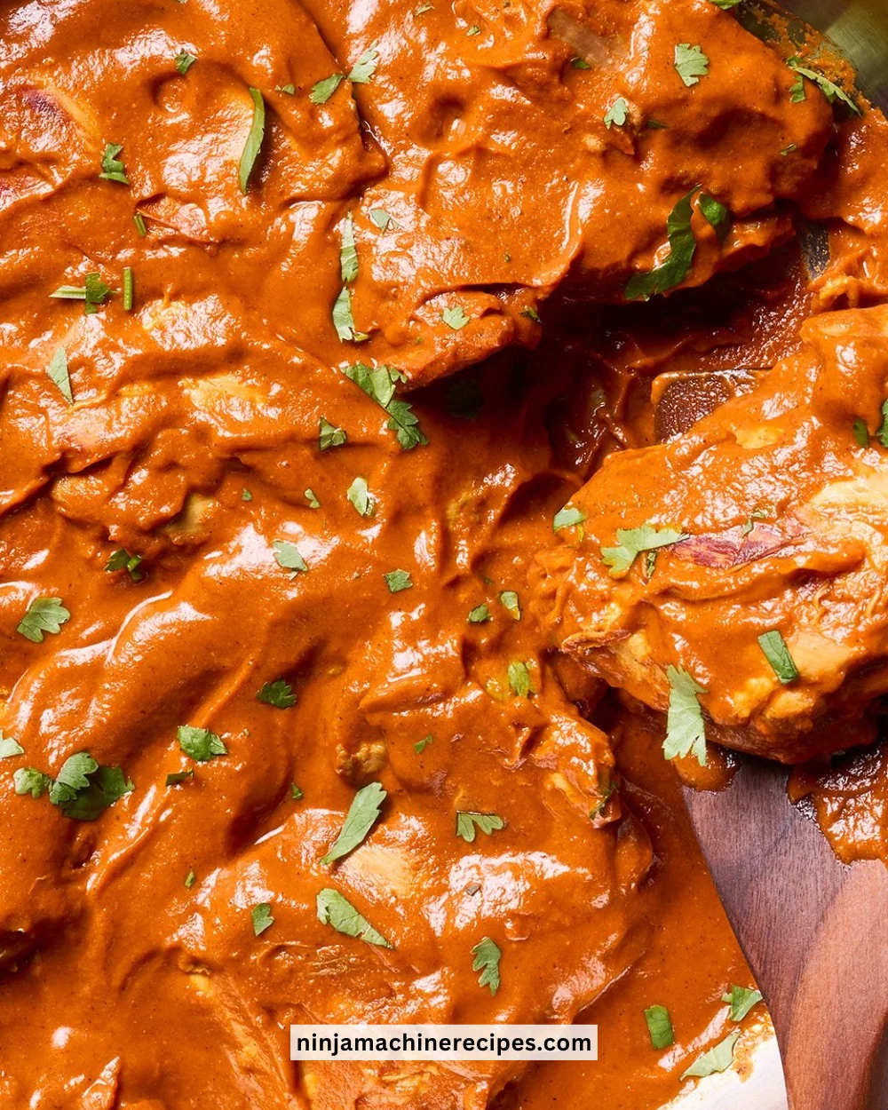 Delicious homemade Chicken Curry served with rice and garnished with fresh herbs