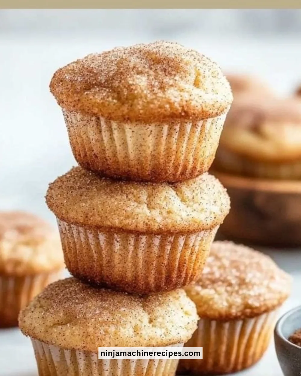 Delicious coffee cake muffin with a crumbly topping and coffee cup