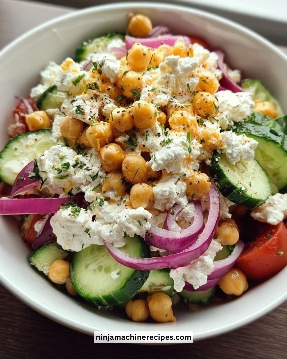 Cottage Cheese Chickpea Salad Bowl with fresh vegetables and herbs