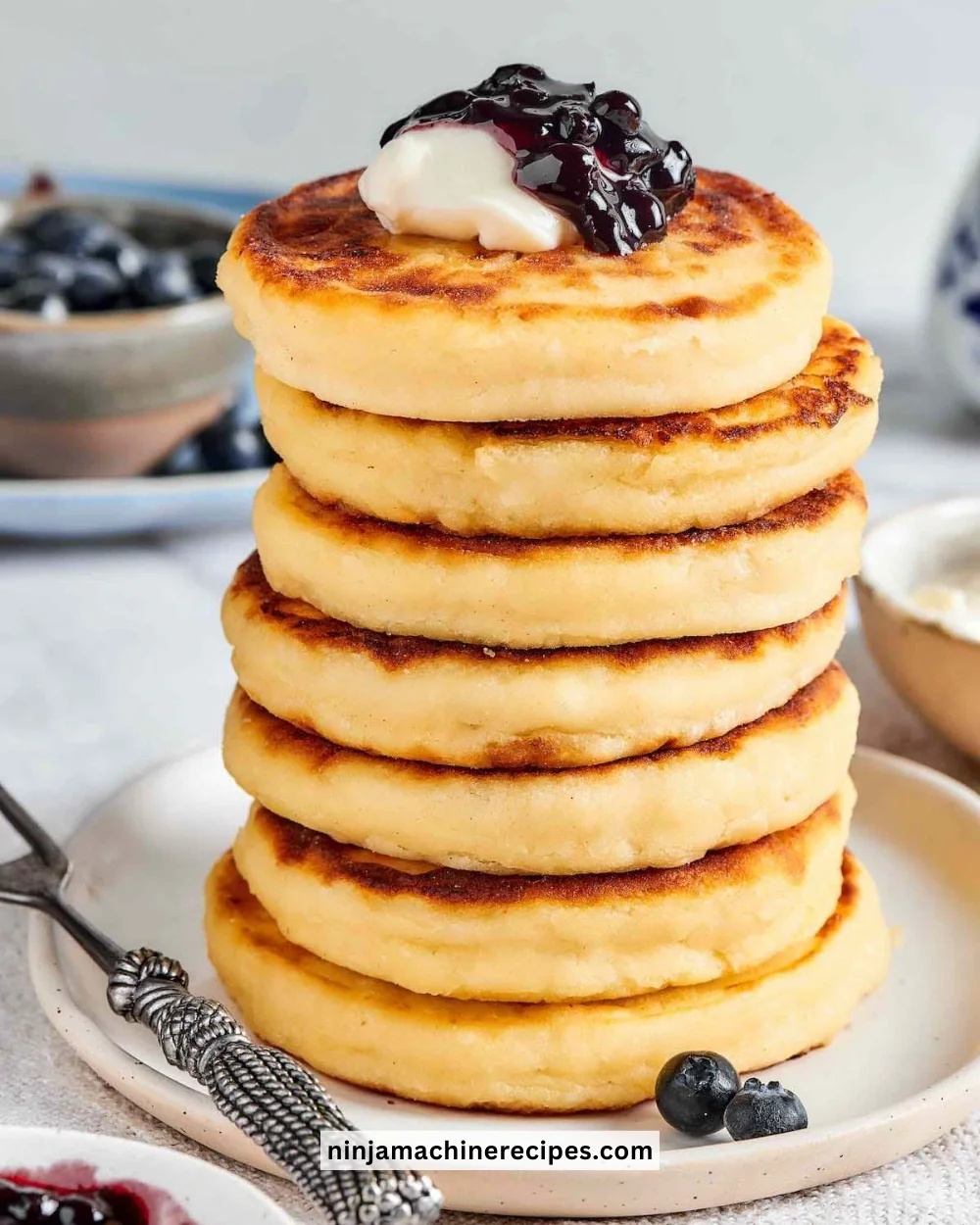 Delicious cottage cheese pancakes served with syrup and fresh berries