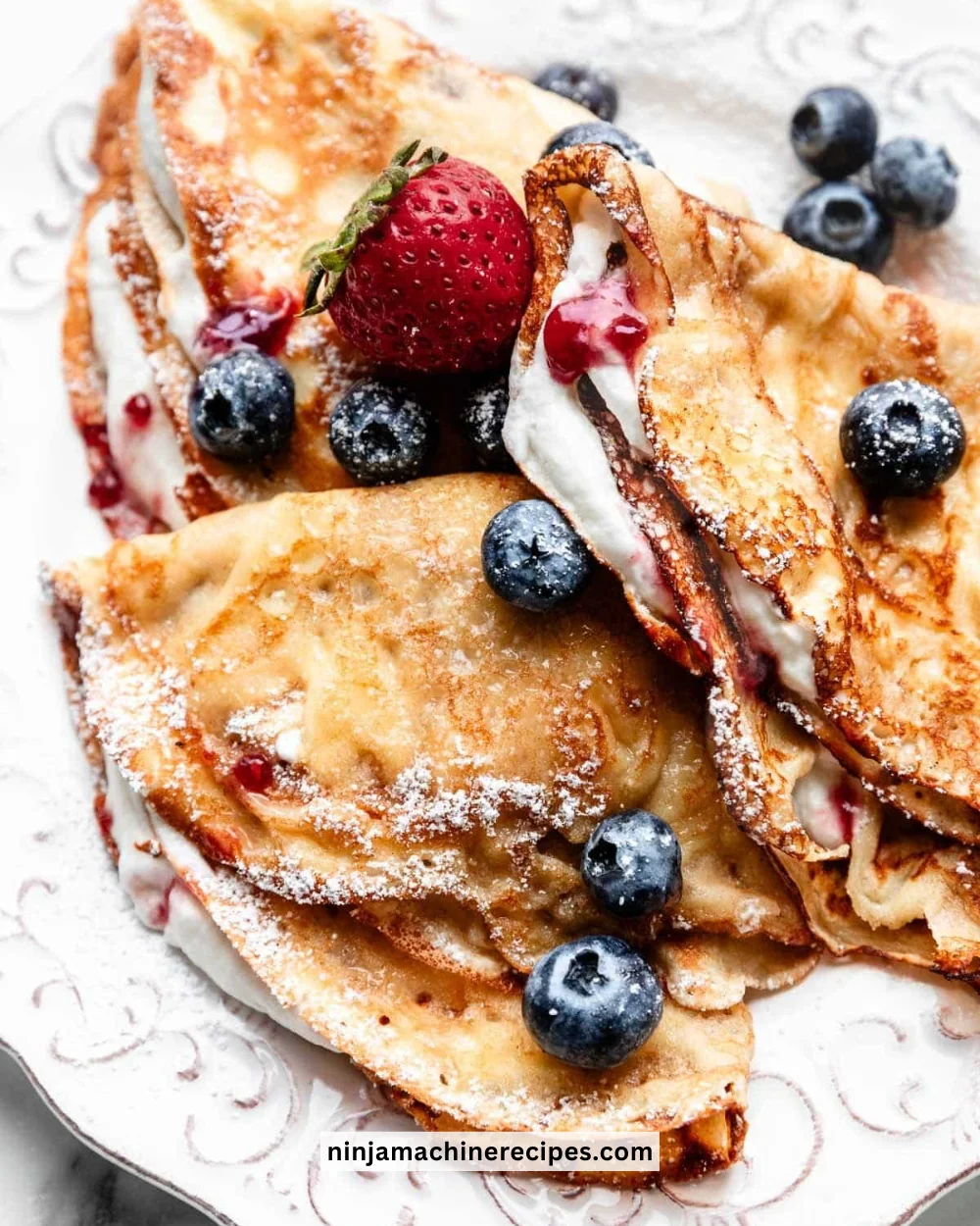 Delicious crepes served on a plate with toppings