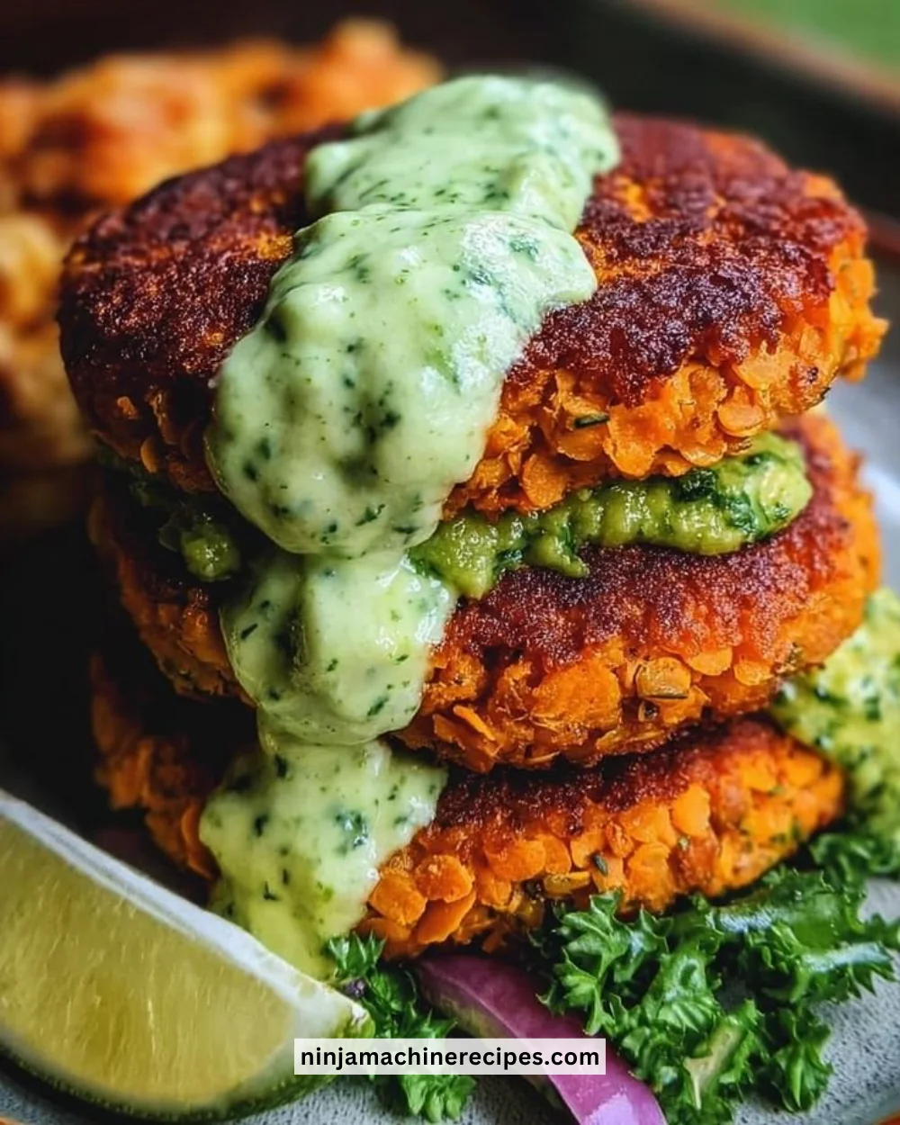 Crispy sweet potato and red lentil patties served with creamy avocado cilantro sauce