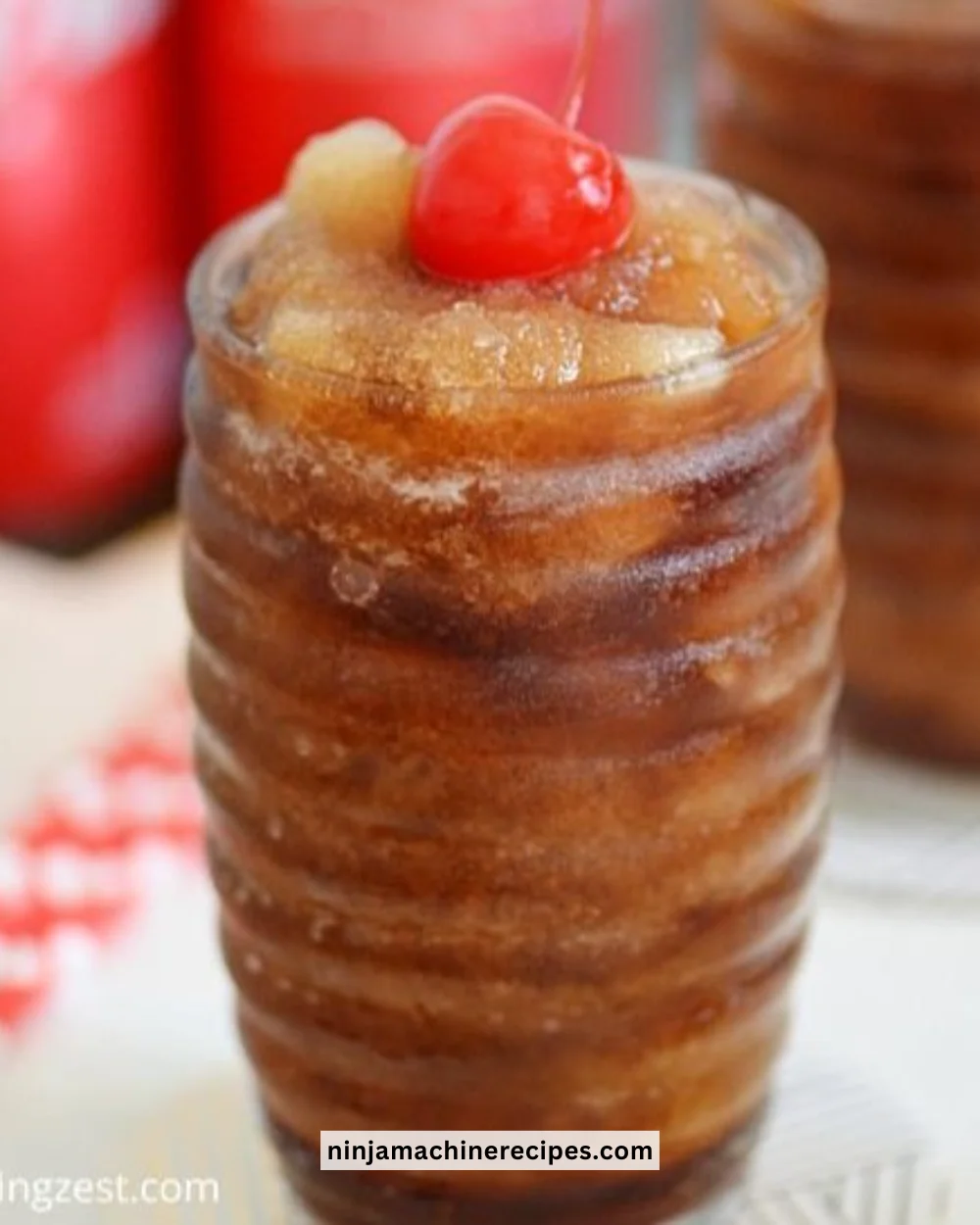 Chilled Frozen Coke beverage in a cup with ice and straw.