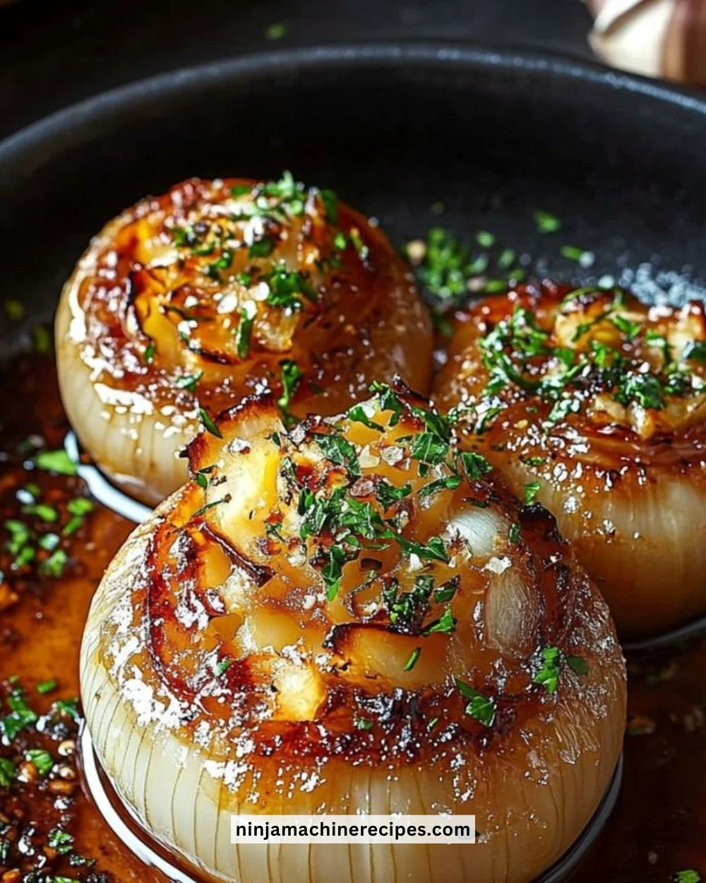 Delicious garlic butter roasted onions served on a plate