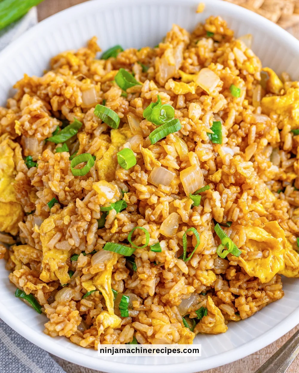 Delicious plate of hibachi fried rice with vegetables and shrimp